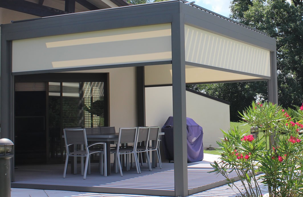 Aluminum pergola with MagnaTrack motorized screens for sun and privacy control, installed by a leading Bellevue pergola company.